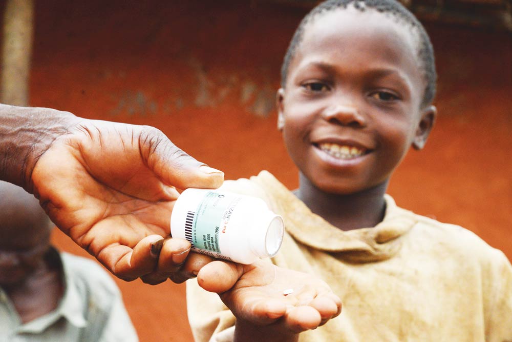 A healthcare worker distributing Mectizan in Nigeria to prevent River Blindness. CBM NZ provides this treatment to stop infection and protect vision.